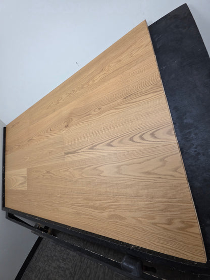 9 1/2" x 5/8" Engineered White Oak Wren Hardwood Flooring shown on a black shooting table. Shot from the right hand side. 