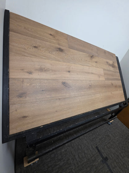 9 1/2" x 9/16" Engineered White Oak Atlas Hardwood Flooring shown on a black shooting table. Shot from the far left 