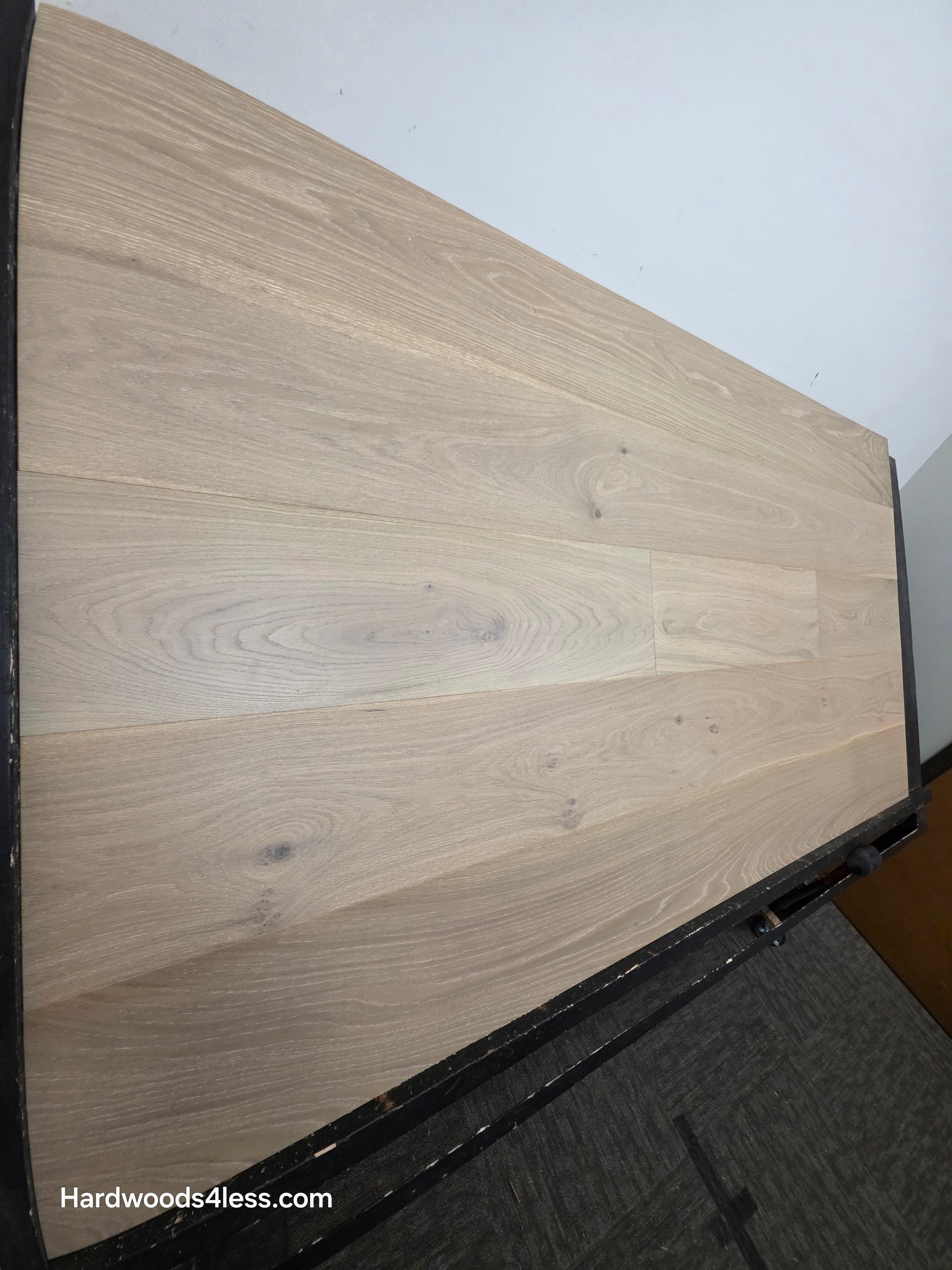 9 1/2" x 9/16" Engineered White Oak Daphne Hardwood Flooring wide shot on a black shooting table
