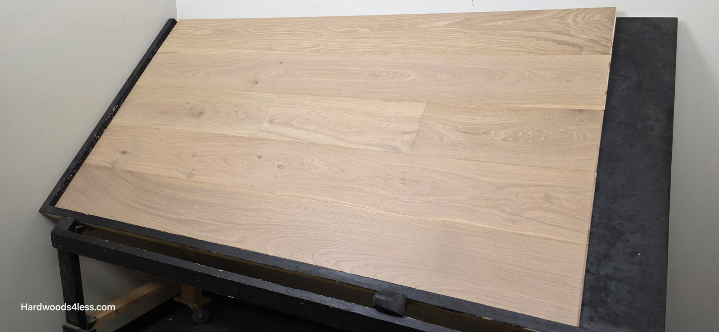 9 1/2" x 9/16" Engineered White Oak Daphne Hardwood Flooring shown on a black shooting table.
