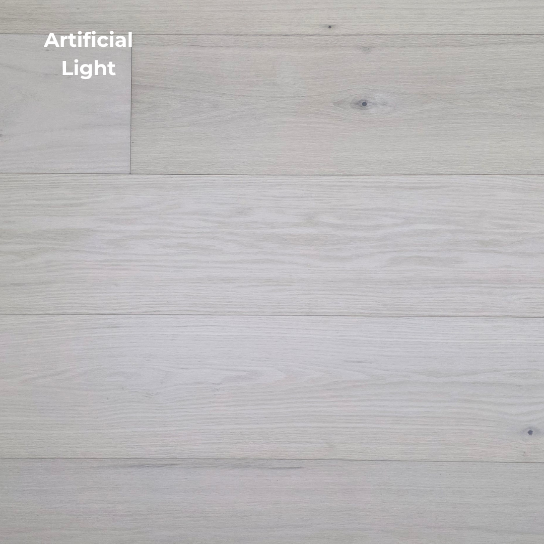 9 1/2" x 5/8" Engineered Red Oak Initium Hardwood Flooring shown in artificial lighting