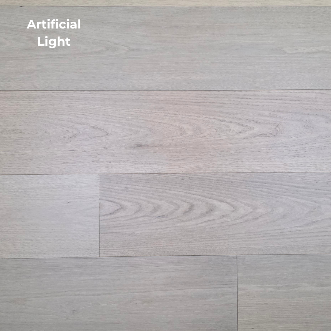 9 1/2" x 5/8" Engineered Red Oak Ophelia Hardwood Flooring shown in artificial light.