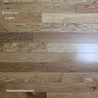 3 1/4" x 3/4" White Oak Natural Hardwood Flooring. Shown on a black shooting table. Shown in artificial lighting. 