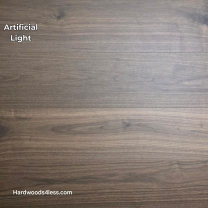 8.11" x 7/16" Modernized Engineered Walnut Calatrava Hardened Hardwood Flooring. Shown in artificial lighting.