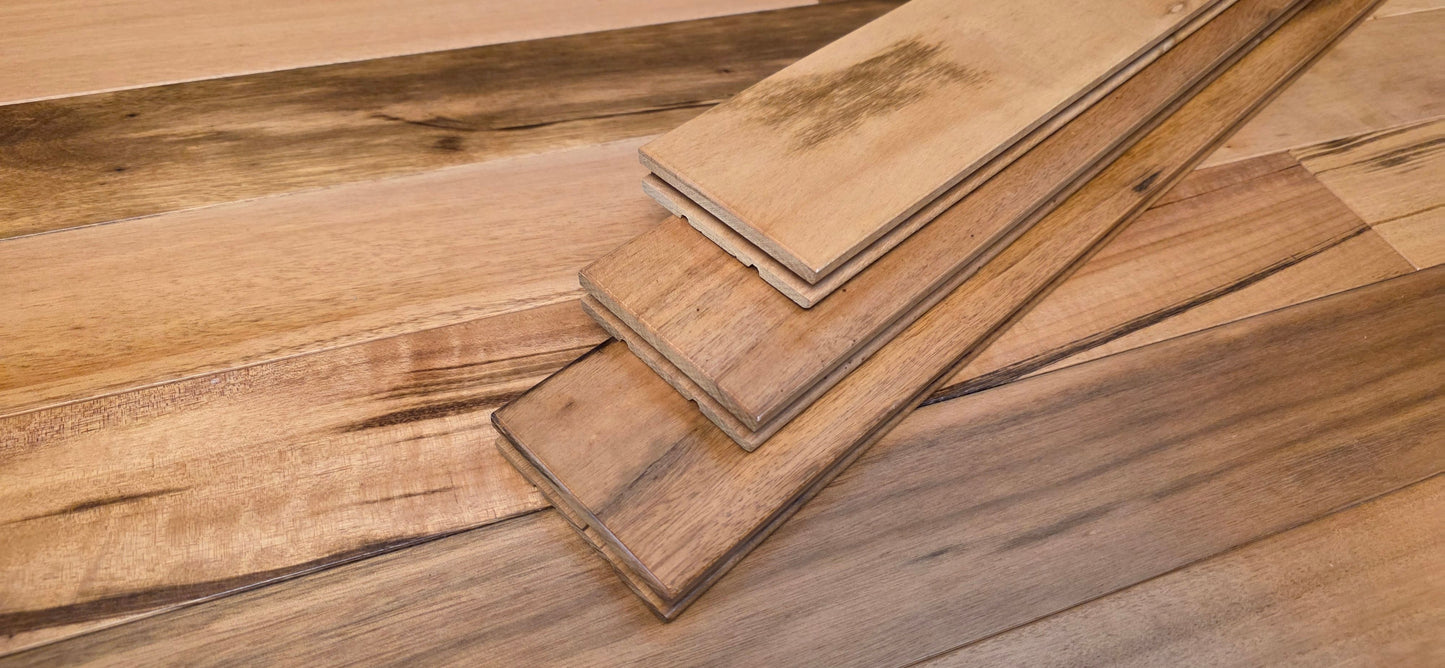 3 1/4" x 3/4" Solid Prefinished Tigerwood Hardwood Flooring. Shown close up with 3 boards stacked on top of each other.
