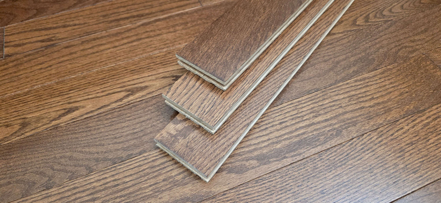 3 1/4" x 3/4" Oak Auburn Hardwood Flooring. Shown as 3 planks stacked on top of each other. 