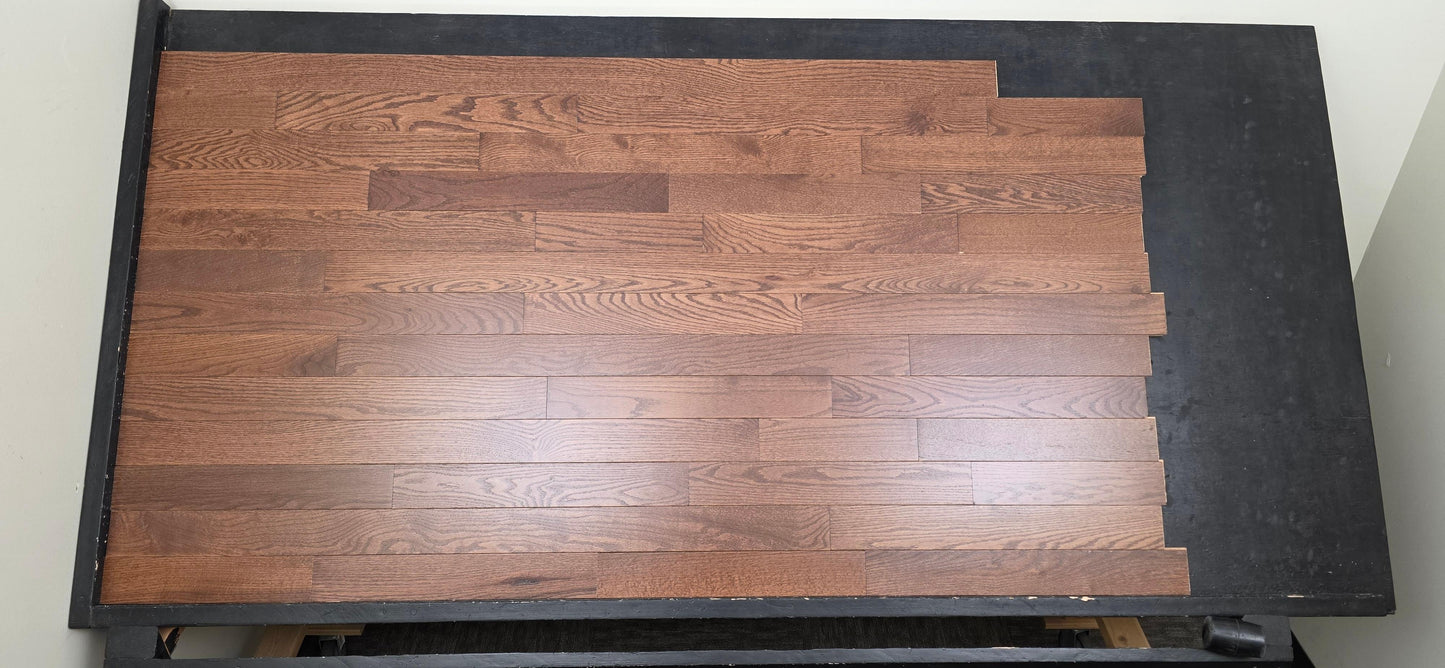 3 1/4" x 3/4" Oak Auburn Hardwood Flooring. Shown on a black shooting table. Shot from center. 