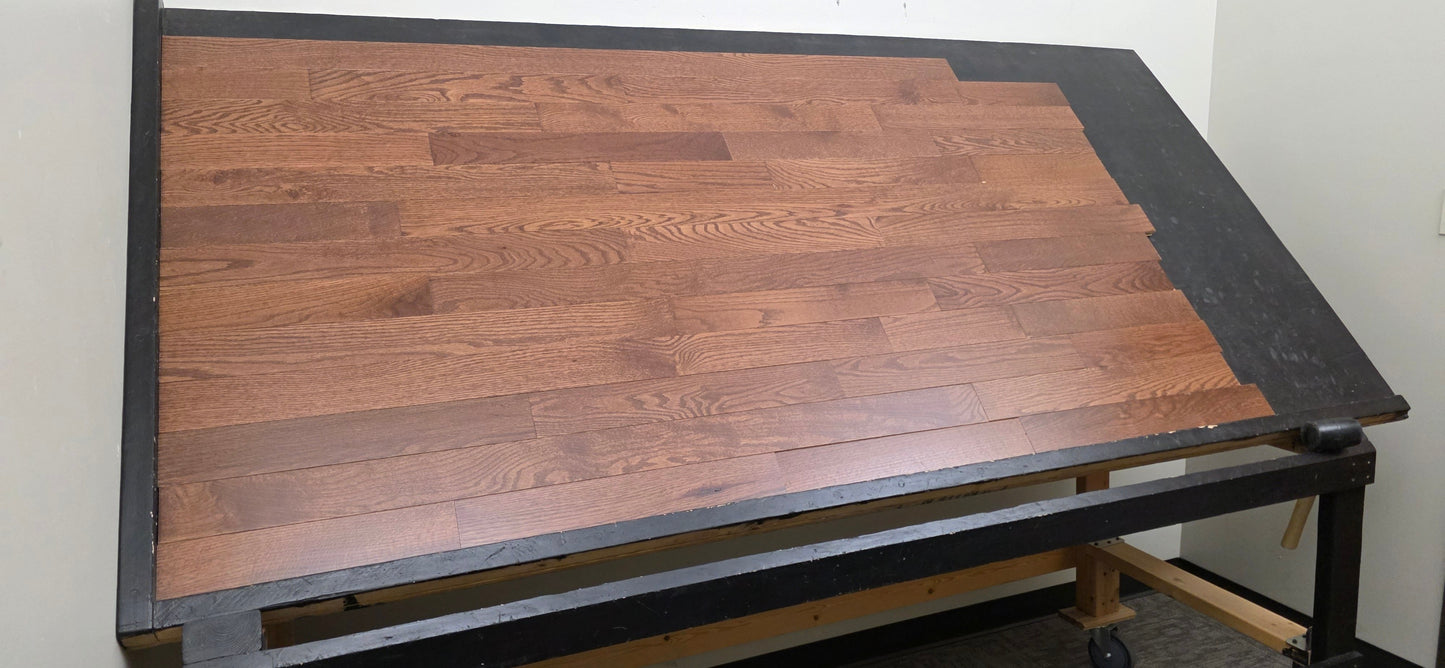 3 1/4" x 3/4" Oak Auburn Hardwood Flooring. Shown on a black shooting table. Shot from wide left.
