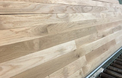 Unfinished White Oak #1 Common Solid Hardwood Flooring. Closeup on a green shooting table. 