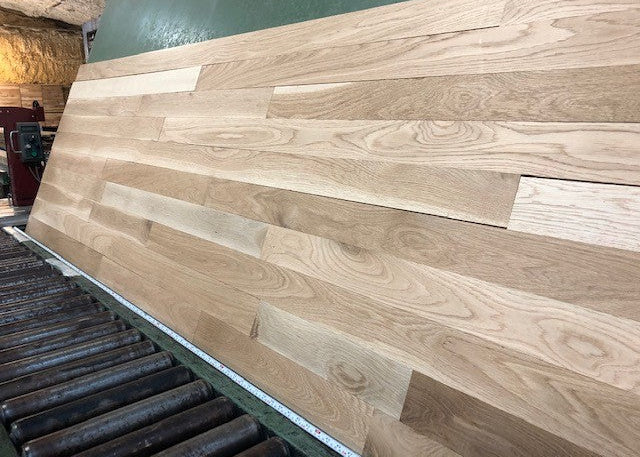 Unfinished White Oak Select & Better Solid Hardwood Flooring shown on a green shooting table wide right side shot