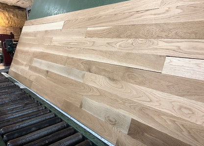 Unfinished White Oak Select & Better Solid Hardwood Flooring shown on a green shooting table wide right side shot